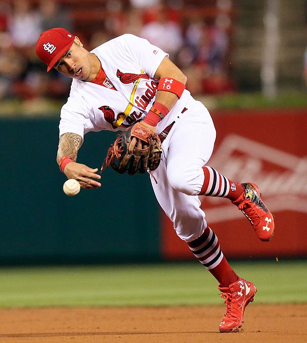 Cardinals second baseman Kolten Wong throws out Stuart Turner of the Reds during the second inning of Tuesday night's game at Busch Stadium in St. Louis.