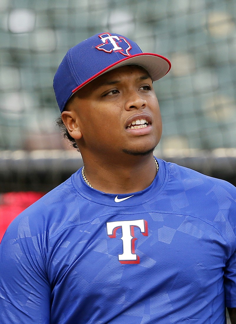 Texas Rangers' Willie Calhoun participates in batting practice before the team's baseball game against the Seattle Mariners on Tuesday, Sept. 12, 2017, in Arlington, Texas. 