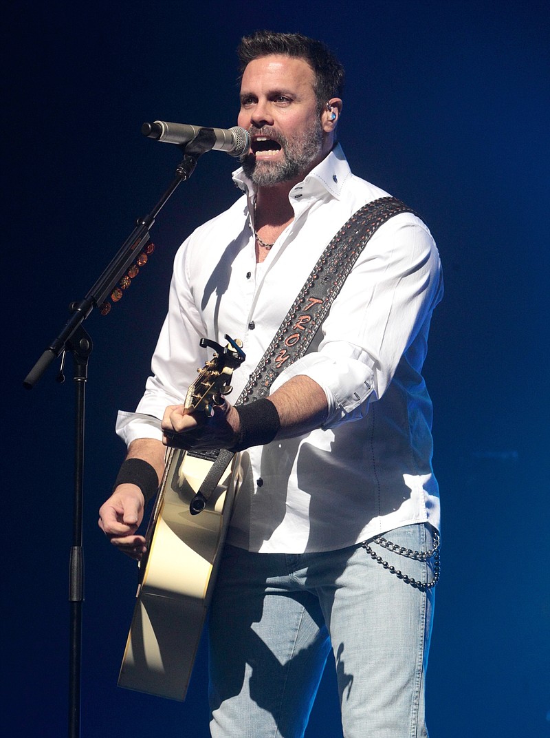 FILE - In this Jan. 17, 2013, file photo, Troy Gentry of the Country Music duo Montgomery Gentry performs on the Rebels On The Run Tour in Lancaster, Pa. Stars of the Grand Ole Opry will gather Thursday, Sept. 14, 2017, to honor country singer Gentry who died in a helicopter crash. (Photo by Owen Sweeney/Invision/AP, File)