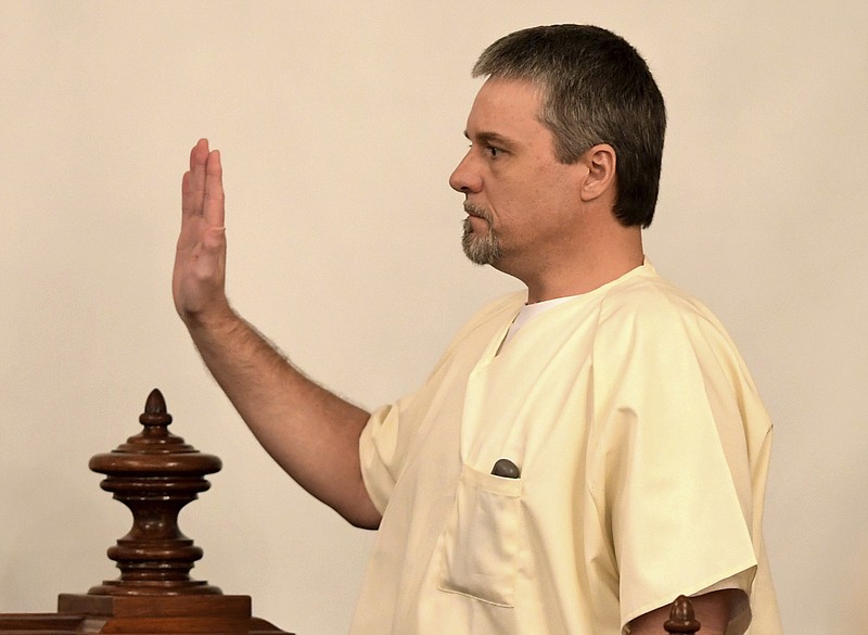 Jason Autry is sworn in by Judge C. Creed McGinley during Zachary Adams' murder trial, Thursday, Sept. 14, in Savannah, Tenn. Holly Bobo, a 20-year-old nursing student, disappeared from her home in Parsons, Tenn., on April 13, 2011, and Zachary Adams is charged with her kidnapping, rape and murder. (Kenneth Cummings/The Jackson Sun via AP, Pool)