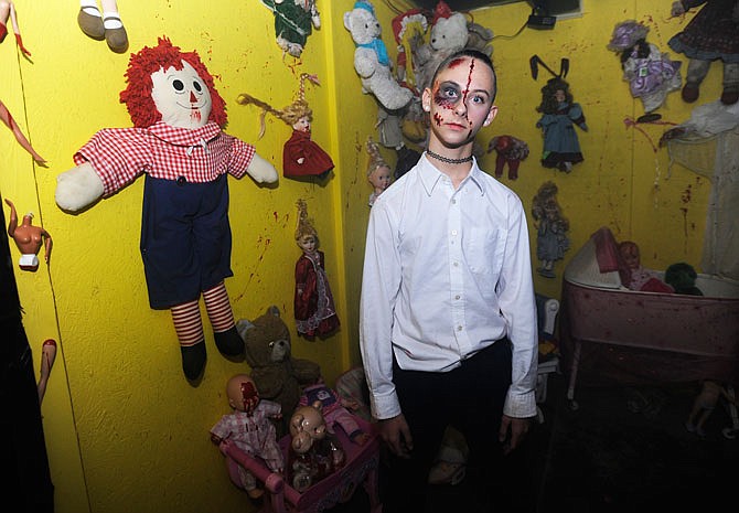 A doll stares and asks "Do you want to play with me?" inside the haunted house. Co-owner Pam DeGroot said the room was inspired by a visitor, who claims they once heard a child's voice asking them to play while camping at their previous location.