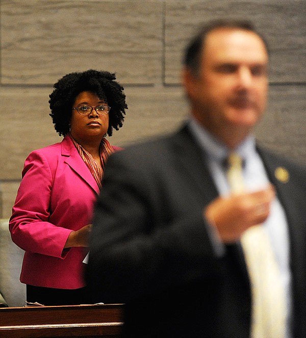 St. Louis Senator Maria Chappelle-Nadal, back, listens as Senator Mike Kehoe discusses whether Chappelle-Nadal should be censured during the veto sessions at the Missouri State Capitol in Jefferson City on Wednesday, September 13, 2017. The Missouri Senate voted to censure Chappelle-Nadal due to a Facebook comment she made hoping for President Trump's assassination. Chappelle-Nadal has since apologized for the comment.