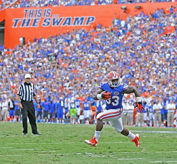 In this Sept. 21, 2013, file photo, then-Florida running back Mack Brown runs a 3-yard touchdown during a game against Tennessee in Gainesville, Fla. Florida decided its SEC opener against Tennessee would be played as scheduled Saturday.