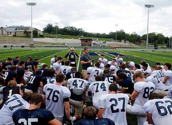 Tim Rulo (center) and the Helias Crusaders look for their first winning streak of the season tonight when they travel to Columbia to take on the Battle Spartans. Both teams enter the game with records of 2-2.