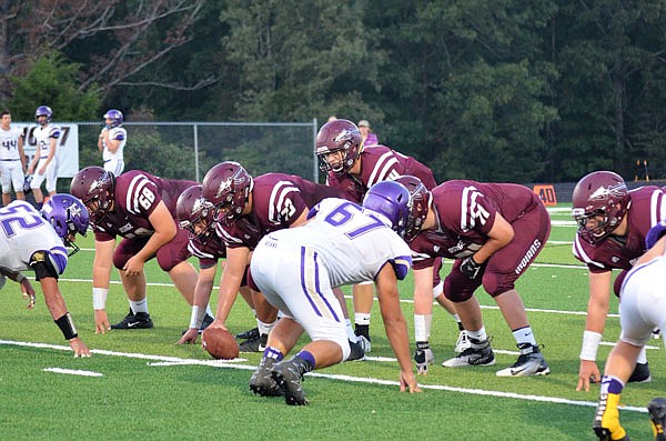 The School of the Osage offense lines up for a play during a game against Hallsville earlier this season.