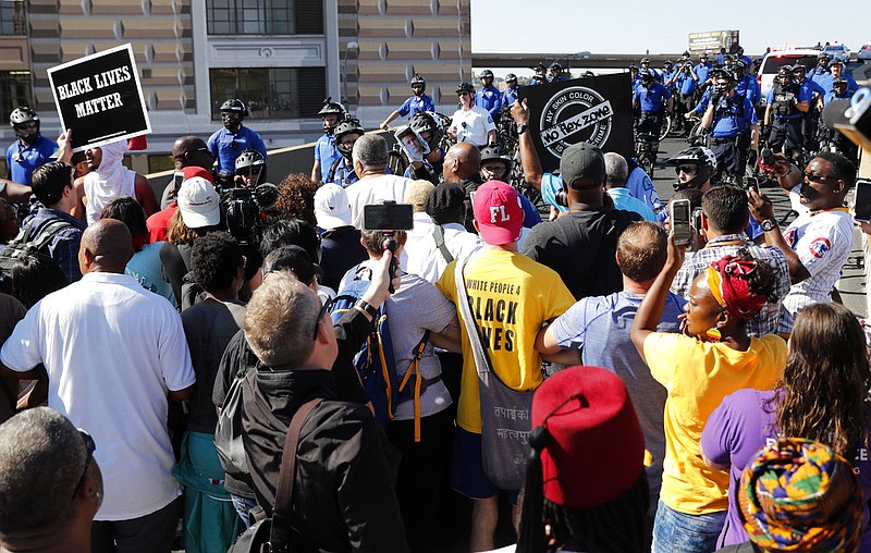 Protesters gather outside of the courthouse, Friday, Sept. 15, 2017, in downtown St. Louis, after a judge found a white former St. Louis police officer, Jason Stockley, not guilty of first-degree murder in the death of a black man, Anthony Lamar Smith, who was fatally shot following a high-speed chase in 2011. (AP Photo/Jeff Roberson)