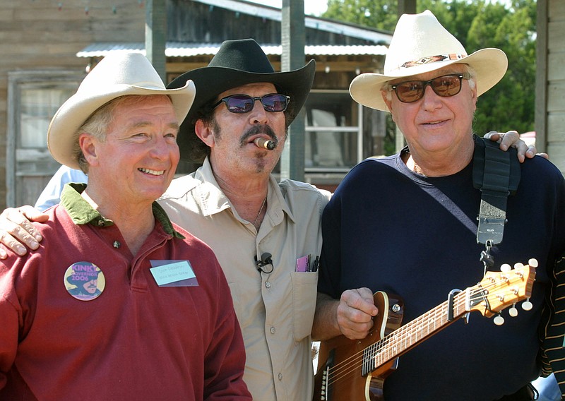 In this Oct. 30, 2005, file photo Texas gubernatorial candidate Kinky Friedman, center, poses with attorney Dick DeGuerin, left, and country singer Jerry Jeff Walker at a campaign fundraiser at Willie Nelson's ranch outside Austin, Texas. Walker has donated his music archives to The Wittliff Collections at Texas State University. The school in San Marcos on Thursday, Sept. 14, 2017, announced the acquisition from the 75-year-old Walker, who in the 1960s emerged from New York's Greenwich Village folk scene. 