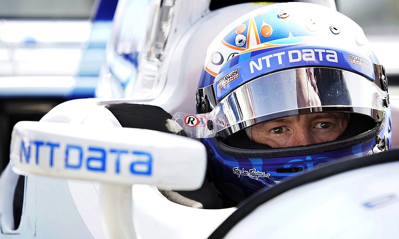 FILE - In this Sept. 1, 2017, file photo, Scott Dixon sits in his car before a practice session for the IndyCar Series auto race in Watkins Glen, N.Y.  When Josef Newgarden hit the wall at Watkins Glen, it blew the championship race wide open and gave Dixon a clear shot at the title. If there's one thing a driver should never do, it is give four-time champion Dixon an opening. ((AP Photo/Matt Slocum, File)