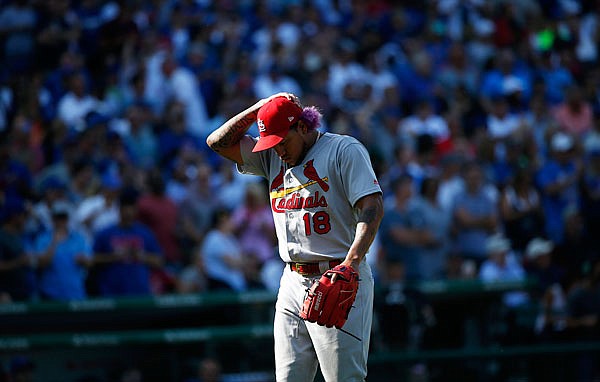 Cardinals starter Carlos Martinez leaves during the sixth inning of Friday's game against the Cubs in Chicago.