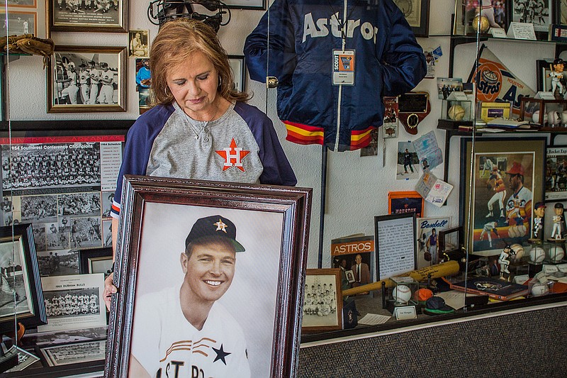 Vicki Matthews poses with a portrait of her late husband and former Astros player, Walter Ray Matthews. The Two Rivers Museum in Ashdown, Ark., will host a tribute to Matthews on Sept. 30. Matthews was from Hicks, Ark., and graduated form Ashdown High School.