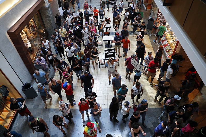 Protesters march through West County Mall in response to a not guilty verdict in the trial of former St. Louis police officer Jason Stockley Saturday, Sept. 16, 2017, in Des Peres, Mo. Stockley was acquitted on Friday, in the 2011 killing of Anthony Lamar Smith, a black man, following a high-speed chase. 