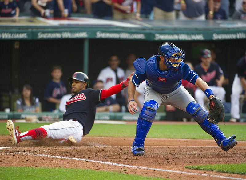 Kansas City Royals' Drew Butera catches the throw to home as Cleveland Indians' Francisco Lindor scores, during a baseball game in Cleveland, Saturday, Sept. 16, 2017. 