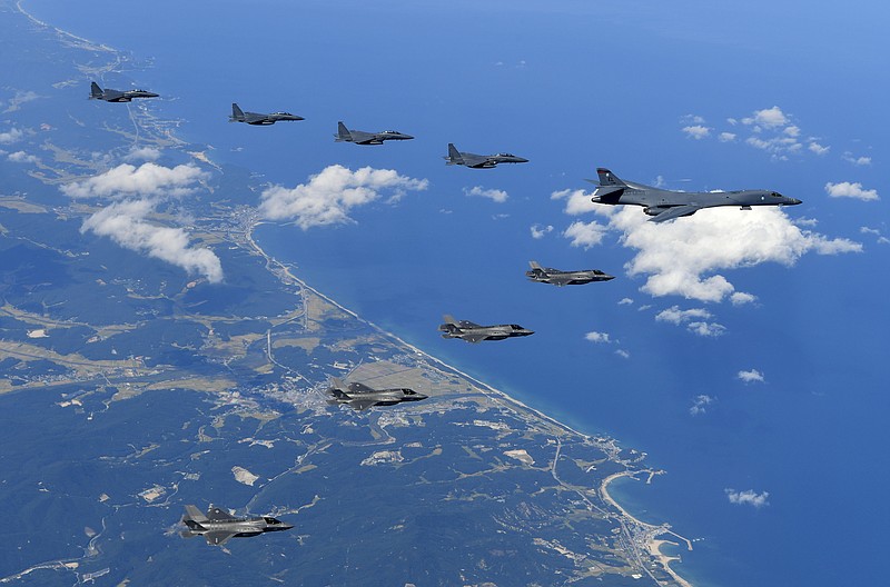 In this photo provided by South Korea Defense Ministry, U.S. Air Force B-1B bomber, F-35B stealth fighter jets and South Korean F-15K fighter jets fly over the Korean Peninsula during a joint drills, South Korea on Monday, Sept. 18, 2017. Monday's flyovers came three days after North Korea fired an intermediate-range missile over Japan into the northern Pacific Ocean in apparent defiance of U.S.-led international pressure on the country. The North conducted its sixth nuclear test on Sept. 3 and was subsequently hit with tough, fresh U.N. sanctions.  (South Korea Defense Ministry via AP)