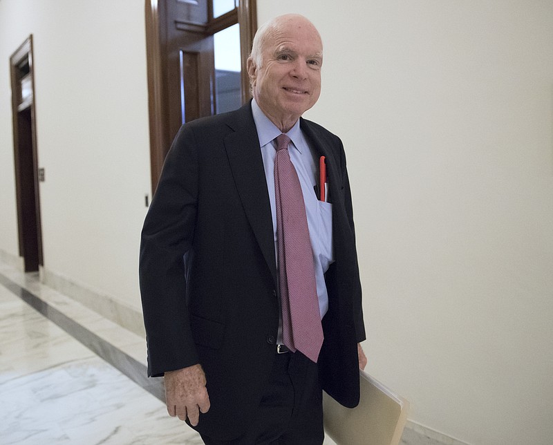 FILE - In this Sept. 5, 2017, file photo, Sen. John McCain, R-Ariz., walks from his Senate office as Congress returns from the August recess in Washington. The Senate is poised to pass a defense policy bill that pumps $700 billion into the Pentagon budget, expands U.S. missile defenses in response to North Korea’s growing hostility and refuses to allow excess military bases to be closed. McCain has guided the bill toward passage over the last week as he railed against Washington gridlock and political gamesmanship.(AP Photo/J. Scott Applewhite, File)