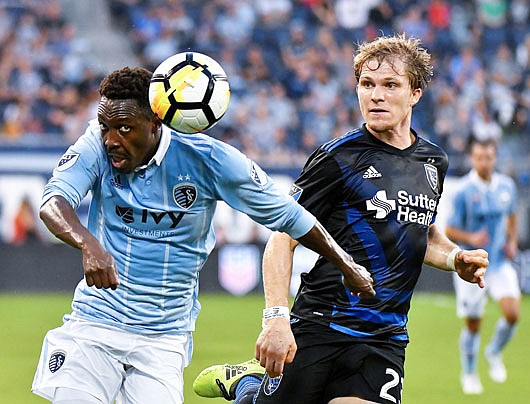In this Aug. 9 photo, Sporting KC forward Gerso Fernandes directs the ball past San Jose Earthquakes midfielder Florian Jungwirth in the first half of a U.S. Open Cup semifinal in Kansas City, Kan.