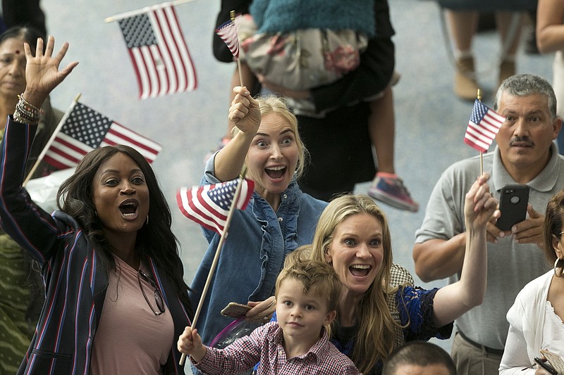 <p>AP</p><p>Family members react as they welcome their relatives as new U.S. citizens after taking the citizenship oath during naturalization ceremonies at a U.S. Citizenship and Immigration Services (USCIS) ceremony in Los Angeles . President Donald Trump issued a videotaped message being played for new American citizens at naturalization ceremonies in which he welcomes immigrants to “the American family.”</p>