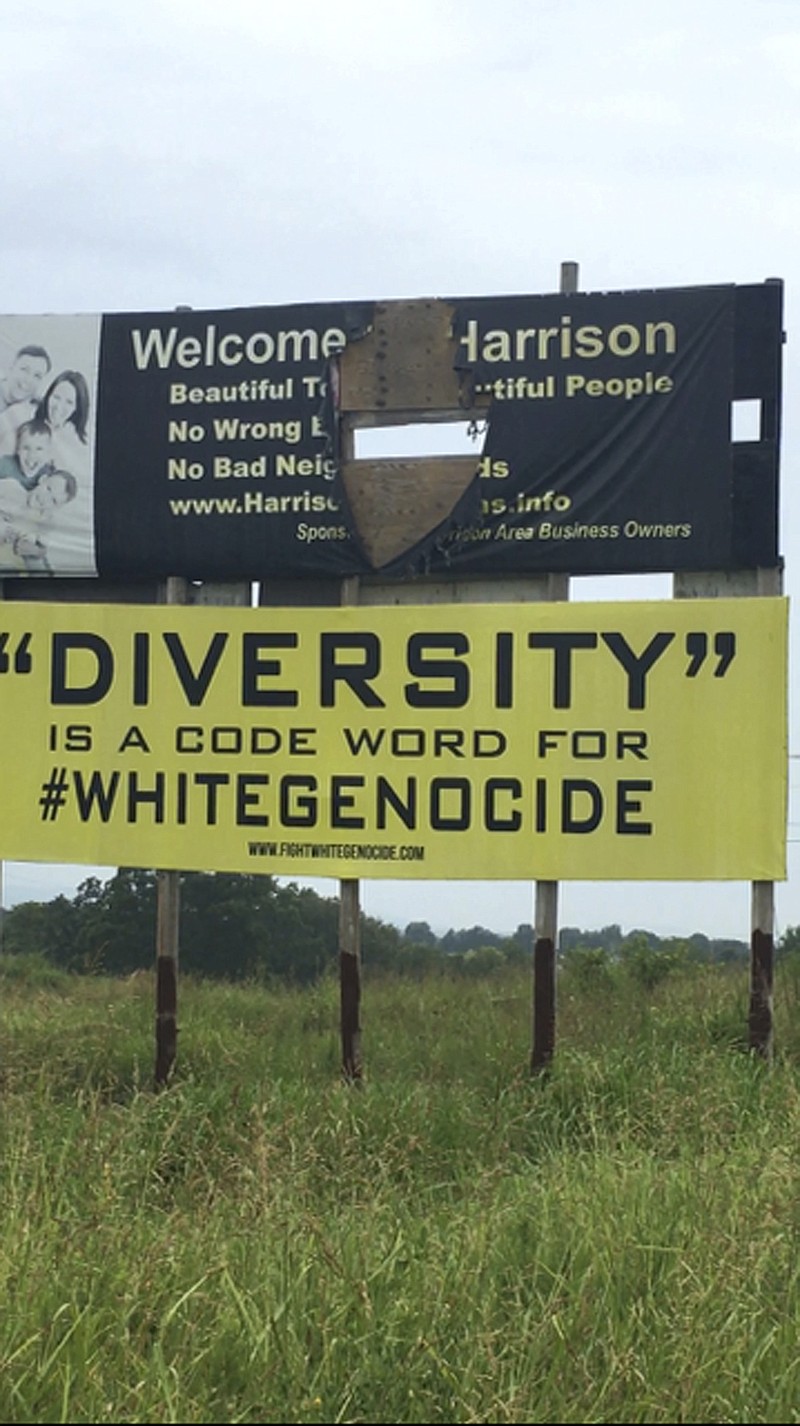 This undated photo provided by Kelsey Bardwell shows a racially charged billboard in Harrison, Ark. Two such billboard signs have been removed at the request of the north Arkansas property owner. Carrie Myers says that when she leased the billboards three years ago she didn't imagine they would have messages such as "Diversity is a code word for white genocide." The signs were taken down after Attorney Cathy Golden and colleague Kelsey Bardwell found the permits for the signage had expired. 