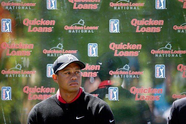 In this May 16, 2016, file photo, Tiger Woods pauses during a Quicken Loans National media availability at Congressional Country Club in Bethesda, Md.