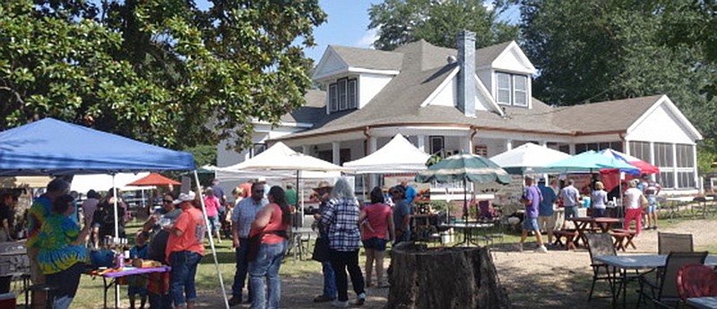 The Boyce and Pam Downs home in Avinger, Texas, makes a pleasant venue for a wine festival.