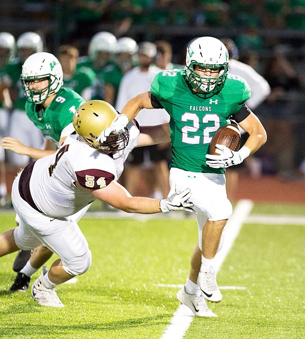 Blair Oaks running back Riley Lentz tries to evade a tackle from Eldon's Riley Pope during a game earlier this month at the Falcon Athletic Complex in Wardsville.