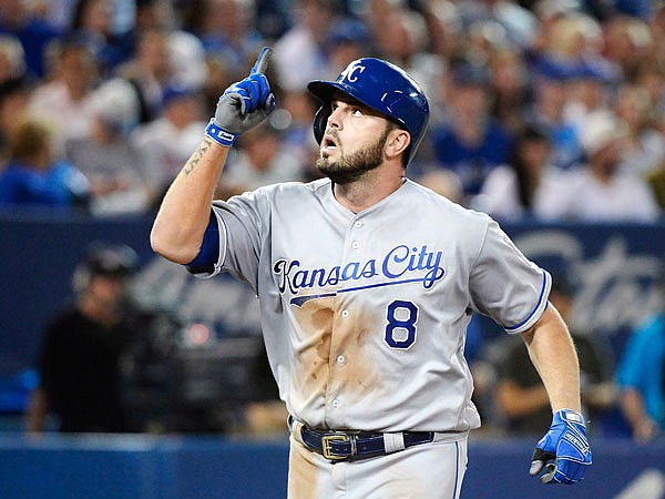 Mike Moustakas of the Royals celebrates his solo home run during the sixth inning of Wednesday night's game against the Blue Jays in Toronto. The home run set the Royals' franchise record for most homers in a season.