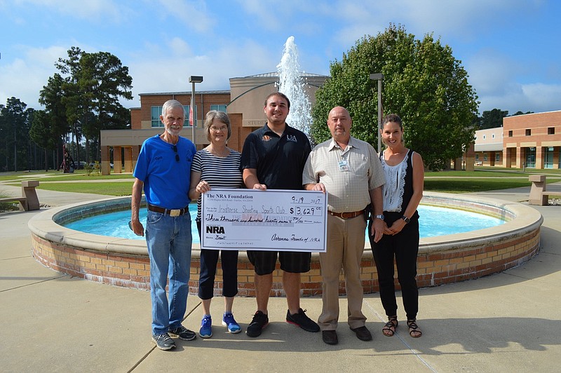 The University of Arkansas at Hope-Texarkana Iron Horse Shooting Team recently received a $3,629 grant from the NRA Foundation to pay championship registration fees. Pictured from left are Cyril Stewart, vice chairman of the Piney Woods Friends of the NRA Chapter AR28; Phyllis Stewart; Nicholas Lerew,of Hope, shooting team member; Haskell Morse, Hempstead County judge; and Jill Bobo, UAHT Foundation executive director. (Submitted photo)