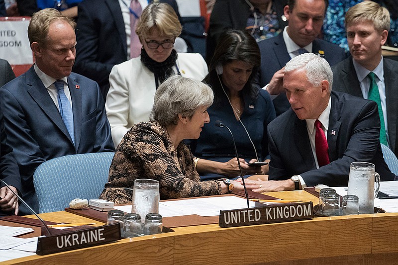U.S. Vice President Mike Pence greets British Prime Minister Theresa May during a high level Security Council meeting on United Nations peacekeeping operations, Wednesday, Sept. 20, 2017 at U.N. headquarters.