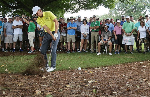 Jordan Spieth hits from the pine straw to the fifth green during Thursday's first round of the Tour Championship at East Lake Golf Club in Atlanta.