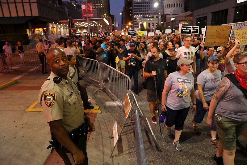 Protesters rally in downtown St. Louis as fans arrive for a Billy Joel concert at Busch Stadium on Thursday, Sept. 21, 2017. The protest was the latest of several since a judge on Friday announced a not-guilty verdict for a white former St. Louis police officer charged in the shooting death of a black suspect. (Christian Gooden/St. Louis Post-Dispatch via AP)