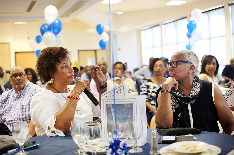 Alumni Debra Maxie, left, poses a question to Lincoln University's interim president, Michael Middleton, while Karen Davis-Nelson, right, listens Friday during an alumni dialogue in Scruggs University Center at Lincoln University.