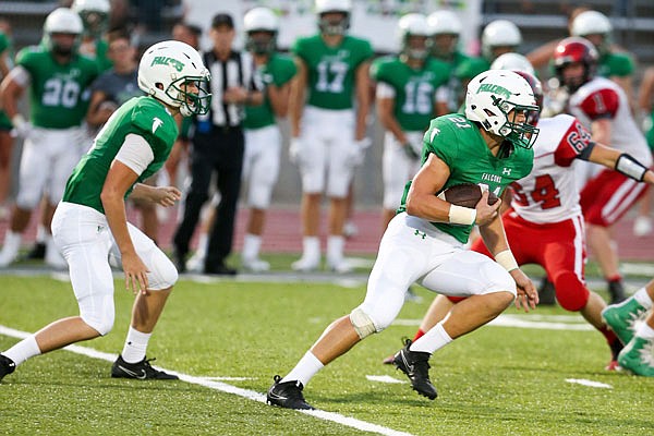 Blair Oaks wide receiver Braydan Pritchett (right) takes a handoff from quarterback Cade Stockman during Friday night's game against Southern Boone in Wardsville.  