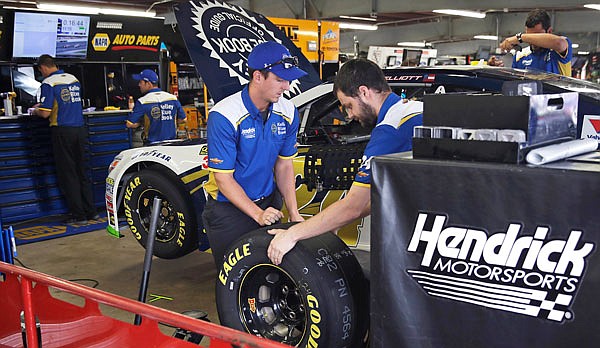 The Hendrick Motorsports race crew for driver Chase Elliott prepare for practice prior to Friday's qualifying for the NASCAR Cup Series race at New Hampshire Motor Speedway in Loudon, N.H.