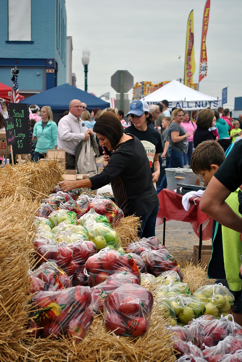 <p>For the Democrat/Samantha Pogue</p><p>Guests browse through a variety of apples available during the Old Tyme Apple Festival in downtown Versailles 2016.</p>