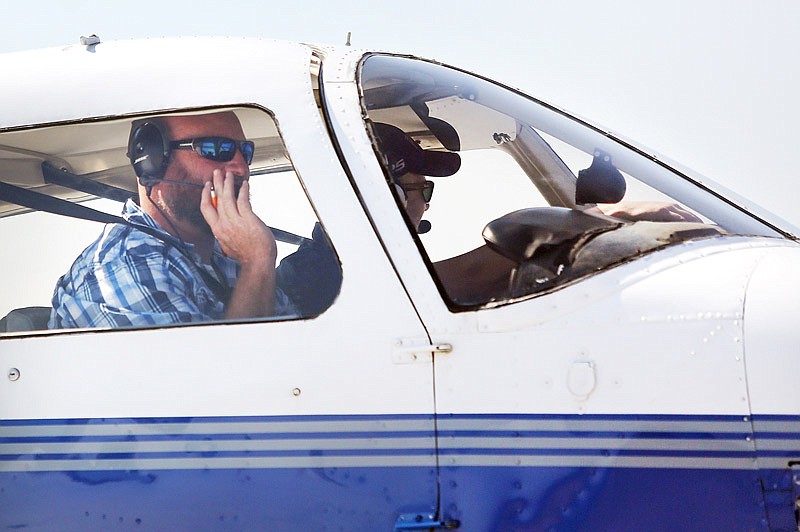 Jon Welker, left, prepares for takeoff in a Piper Warrior plane Wednesday, Sept. 20, 2017 at the Jefferson City Memorial Airport. Welker intends to get his commercial pilot's license.