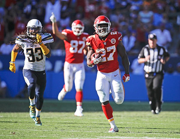 Chiefs running back Kareem Hunt scores on a 69-yard touchdown run late in the fourth quarter against the Chargers during the second half of Sunday's game in Carson, Calif.