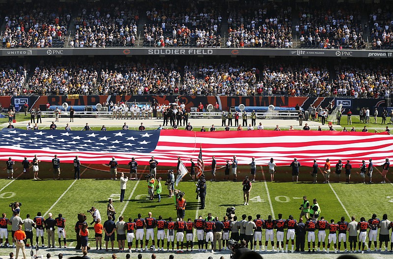 The Pittsburgh Steelers side of the field is nearly empty during the playing of the national anthem before an NFL football game between the Steelers and Chicago Bears Sunday in Chicago. Recent protests during the anthem have spurred a backlash from fans—and even President Donald Trump—who see them as disrespectful.