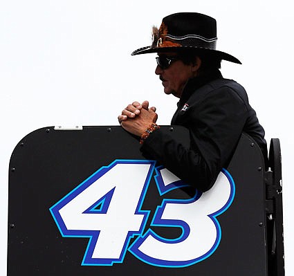 Racing legend Richard Petty watches practice prior to qualifying Friday at New Hampshire Motor Speedway in Loudon, N.H.