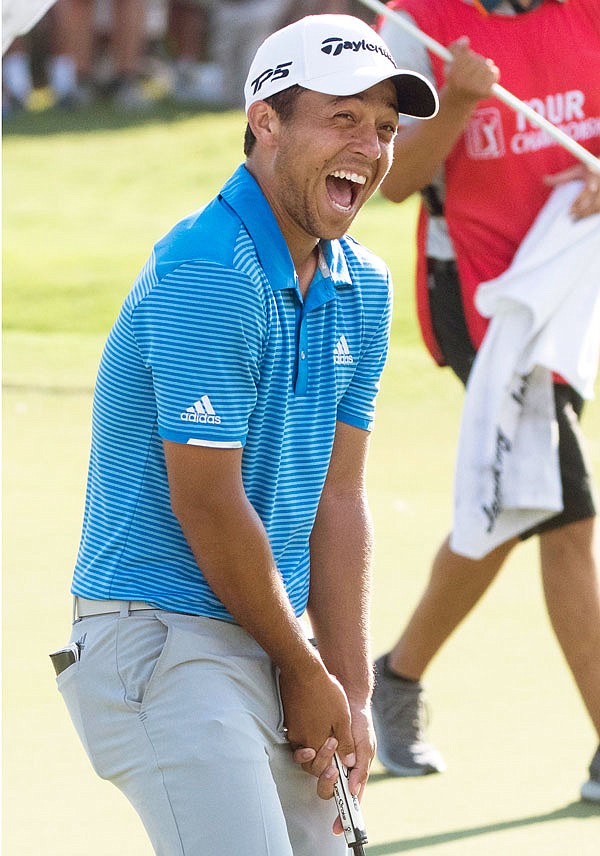 Xander Schauffele reacts after making a birdie putt on the 18th hole to win the Tour Championship on Sunday at East Lake Golf Club in Atlanta.