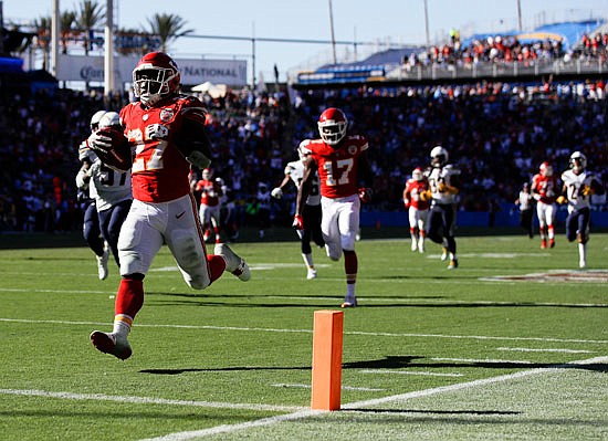 Chiefs running back Kareem Hunt prepares to cross the goal line late in the fourth quarter of Sunday's game against the Chargers in Carson, Calif.