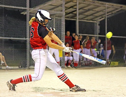 Jefferson City's Kara Daly smacks a two-run double to left field during the fifth inning of Monday night's game against Sedalia Smith-Cotton at 63 Diamonds.