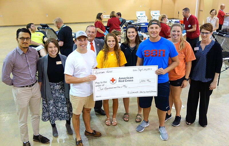 Westminster College students raised money to donate towards the American Red Cross's Hurricane Harvey relief efforts this month, raising $205.29 in three days. Present at the check presentation were Ayush Manandhar, left, intercultural engagement fellow at Westminster; Chaplain Resident Kiva Nice-Webb, student Zach Gabel, David Griffith (executive director, ARC of Central & Northern Missouri), students Angela Vanderpluym, Madison Ekern and Ben Davis and Jennifer Brooks, Columbia ARC account manager.