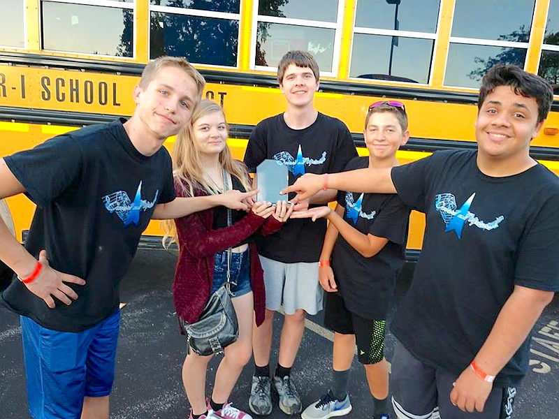 The Russellville High School drumline made school history Oct. 7, earning the school's first-ever "best percussion award" at the 49th annual Washington Marching Festival. (Democrat photo/Michelle Brooks)