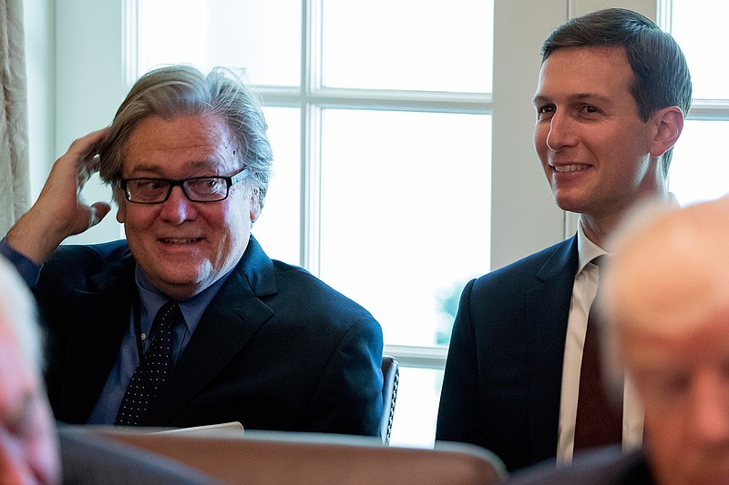 In this June 12, 2017 file photo, White House Senior Advisers Steve Bannon, left, and Jared Kushner attend a Cabinet meeting with President Donald Trump in the Cabinet Room of the White House in Washington. Differences between Hillary Clinton's email practices while secretary of state and Revelations that officials in the Trump administration have used private email accounts for White House business have prompted charges of hypocrisy after Donald Trump made a campaign issue of the email practices by Democratic candidate Hillary Clinton. Despite the uproar over the practice during the campaign, key Trump officials began using their own private email accounts just weeks after the election that they concede were sometimes used for official communication. 