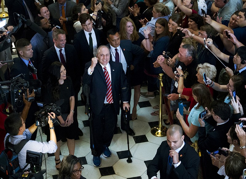 House Republican Whip Steve Scalise walks with his wife Jennifer, left, as he leaves the House chamber in the Capitol in Washington, Thursday, Sept. 28, 2017. To hugs and a roaring bipartisan standing ovation, Scalise returned to the House, more than three months after a baseball practice shooting left him fighting for his life.( AP Photo/Jose Luis Magana)