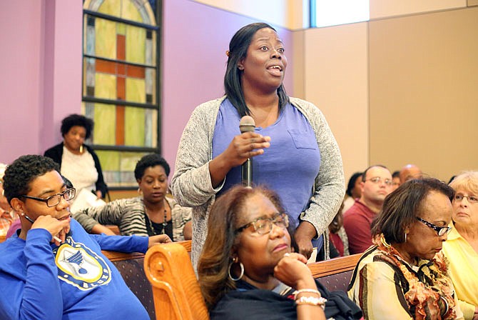 Tahtiana Lane, center, speaks Wednesday during Quinn Chapel A.M.E. Church's town hall meeting on race relations in Jefferson City. The meeting was prompted following the circulation of a racist photo on social media by Jefferson City High School students.