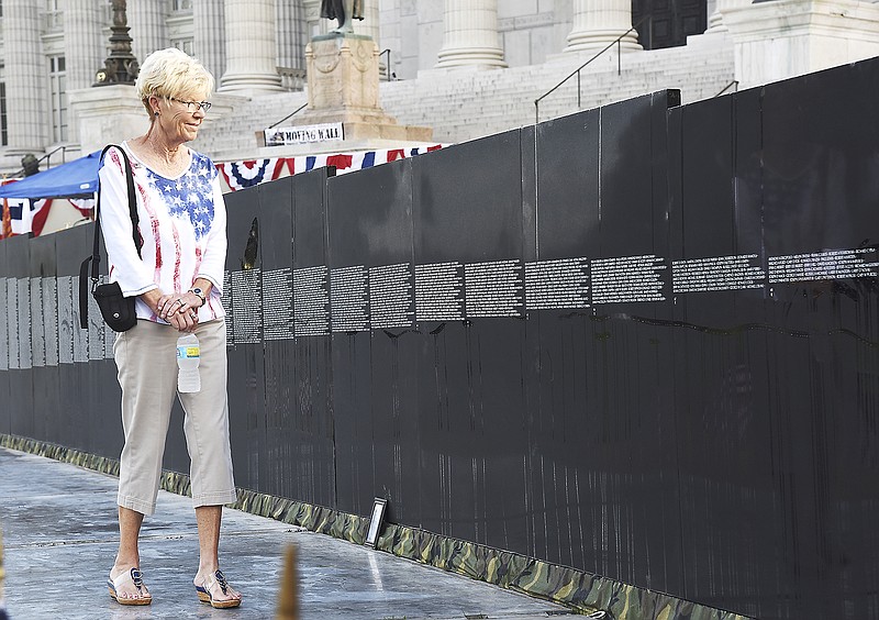 Sharon Naught was a volunteer reader one morning in 2015, but before she called out the names, she walked along the quiet, dew-covered ramp in front of the Moving Wall and took in the solemn sight of the names.