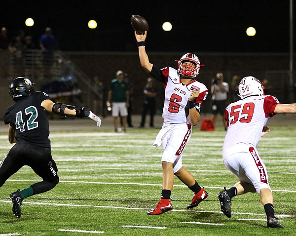 Jefferson City quarterback Devin Roberson throws downfield during last week's game against Rock Bridge in Columbia.