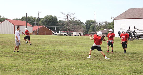 The Tipton offense works on a pass play during a preseason practice last month in Tipton. Head coach Tony Braby believes the Cardinals had the most passing attempts in a single game during his tenure in last Friday's 42-14 loss to Class 1 No. 5 Lincoln.