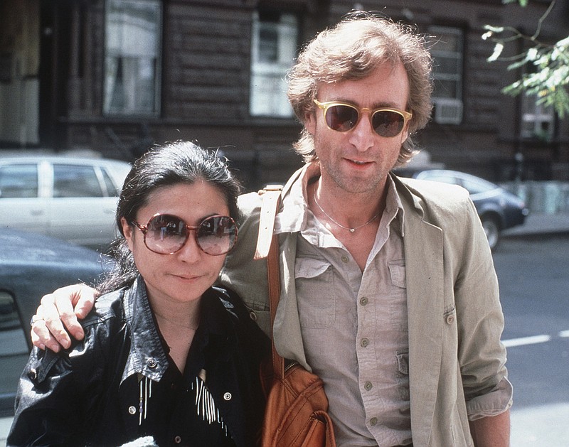 FILE - In this Aug. 22, 1980, file photo, John Lennon, right, and his wife, Yoko Ono, arrive at The Hit Factory, a recording studio in New York. Playboy has met with political leaders, activists and athletes.. A joint interview with Lennon and Yoko Ono came out Dec. 6, 1980, two days before the former Beatle was murdered by a deranged fan.  (AP Photo/Steve Sands, File)