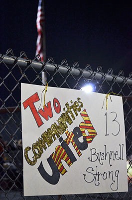 A sign at the gate honors injured Eldon player Hunter Bushnell at Friday night's game between Eldon and Versailles in Versailles. Eldon won the game 69-20.